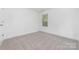 Bright bedroom featuring neutral carpet, white walls, and natural light at 304 Adams St, Salisbury, NC 28144