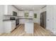 Charming kitchen features white cabinets, granite countertops, stainless appliances and an island at 304 Adams St, Salisbury, NC 28144