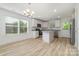 Bright kitchen featuring white cabinets, granite countertops, stainless appliances and an island at 304 Adams St, Salisbury, NC 28144