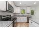Charming kitchen with stainless appliances, granite counters, and white cabinetry at 304 Adams St, Salisbury, NC 28144