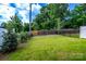 Grassy backyard enclosed by fencing, ideal for outdoor activities and privacy at 4005 Easton Ridge Ln, Charlotte, NC 28226