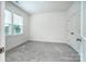 Empty bedroom featuring a carpet, a window, and white walls at 4005 Easton Ridge Ln, Charlotte, NC 28226