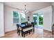 Light-filled dining room with a modern chandelier and sliding glass doors to the patio at 4005 Easton Ridge Ln, Charlotte, NC 28226