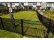 Fenced dog park with green space and waste station for residents' convenience and pet enjoyment at 4005 Easton Ridge Ln, Charlotte, NC 28226