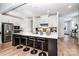 Modern kitchen with stainless steel appliances, center island, and breakfast bar seating at 4005 Easton Ridge Ln, Charlotte, NC 28226