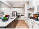 Spacious open kitchen features modern appliances and an island with seating at 4005 Easton Ridge Ln, Charlotte, NC 28226