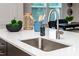 The stylish kitchen island has a sink and plenty of counter space at 4005 Easton Ridge Ln, Charlotte, NC 28226