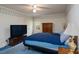 A comfortable bedroom with carpet, furnishings and a television at 403 Cherrywood Ln, Albemarle, NC 28001
