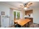 Inviting dining area with wooden table, chairs, and view to the outside through sliding glass doors at 403 Cherrywood Ln, Albemarle, NC 28001