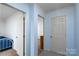 Hallway displaying neutral paint and carpet connecting various rooms of the house at 403 Cherrywood Ln, Albemarle, NC 28001