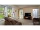 Cozy living room with natural light, neutral walls, and comfortable seating at 403 Cherrywood Ln, Albemarle, NC 28001