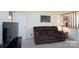 Inviting living room with plush seating, soft lighting, and a relaxed atmosphere at 403 Cherrywood Ln, Albemarle, NC 28001