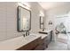 Modern bathroom showcasing dual vanities and large tile walls at 4108 Commonwealth Ave, Charlotte, NC 28205