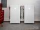Cleanly installed Tesla Powerwall batteries in a garage, providing backup power solution at 4108 Commonwealth Ave, Charlotte, NC 28205