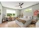 Bright, airy bedroom featuring a plush rug and views of the outdoor greenery at 4108 Commonwealth Ave, Charlotte, NC 28205