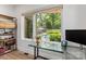 Bright view from a bedroom/office with backyard pool, patio, and landscaping at 4108 Commonwealth Ave, Charlotte, NC 28205