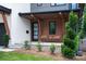 Inviting front porch featuring modern design elements, comfortable seating, and manicured landscaping at 4108 Commonwealth Ave, Charlotte, NC 28205