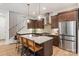 Modern kitchen with stainless steel appliances, a large island, and wooden bar stools at 4108 Commonwealth Ave, Charlotte, NC 28205