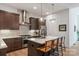 Gourmet kitchen with stainless steel appliances, a center island, and pendant lighting at 4108 Commonwealth Ave, Charlotte, NC 28205