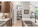 Modern kitchen with stainless steel appliances, center island, and walk-in pantry at 4108 Commonwealth Ave, Charlotte, NC 28205