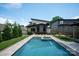 Modern home showcasing a luxurious backyard pool and spa with sleek design and landscaping at 4108 Commonwealth Ave, Charlotte, NC 28205