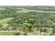 Expansive aerial view of wooded property with home, highlighting the lot's size and privacy at 4335 E Nc 10 Hwy, Claremont, NC 28610