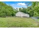 Exterior of a large white barn in a fenced in yard with trees at 4335 E Nc 10 Hwy, Claremont, NC 28610