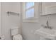 A small bathroom with white walls and a pedestal sink at 4335 E Nc 10 Hwy, Claremont, NC 28610