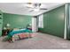 Bedroom features green walls, a ceiling fan and carpeting at 4335 E Nc 10 Hwy, Claremont, NC 28610