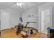 Bedroom featuring hardwood floors and white painted brick fireplace at 4335 E Nc 10 Hwy, Claremont, NC 28610