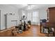 Bedroom featuring hardwood floors, a fireplace, and bright natural light at 4335 E Nc 10 Hwy, Claremont, NC 28610