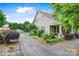 Charming home showcasing a long driveway, mature landscaping, and a tranquil setting at 4335 E Nc 10 Hwy, Claremont, NC 28610