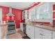 Bright kitchen featuring stainless steel appliances and white cabinets at 4335 E Nc 10 Hwy, Claremont, NC 28610