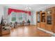 Sunlit living room featuring hardwood floors and a large window at 4335 E Nc 10 Hwy, Claremont, NC 28610