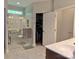 Bright bathroom featuring a walk-in shower, closet, and a marble-topped vanity at 4660 Gold Finch Dr, Denver, NC 28037