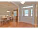 Elegant foyer with hardwood floors, a dining room view, and a bright, welcoming entrance at 4660 Gold Finch Dr, Denver, NC 28037