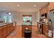 Bright kitchen featuring granite counters, stainless appliances and wood floors at 4660 Gold Finch Dr, Denver, NC 28037