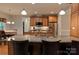 Spacious kitchen with granite countertops, stainless appliances, and ample cabinet storage at 4660 Gold Finch Dr, Denver, NC 28037