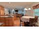 Open kitchen with granite counters and seating that connects to the living area at 4660 Gold Finch Dr, Denver, NC 28037
