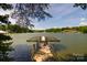 Picturesque lake view featuring a private dock and serene waterfront setting at 4660 Gold Finch Dr, Denver, NC 28037