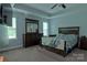 Comfortable bedroom featuring neutral tones, a large bed, and plenty of closet space at 4660 Gold Finch Dr, Denver, NC 28037