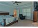 Tranquil bedroom with trey ceiling, plush carpeting, and relaxing window seating at 4660 Gold Finch Dr, Denver, NC 28037