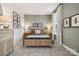 Charming bedroom with natural wood bed and soft color palette at 5111 Raging Creek Dr, Indian Trail, NC 28079