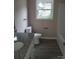 Bathroom featuring granite vanity, new fixtures, and a shower-tub combo at 528 S Caldwell St, Salisbury, NC 28144
