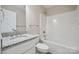 Bathroom with granite vanity top and shower and bath combo at 528 S Caldwell St, Salisbury, NC 28144