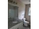 Bathroom featuring granite vanity, new fixtures, and a shower-tub combo at 528 S Caldwell St, Salisbury, NC 28144