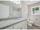 Bathroom featuring a large mirror and granite countertops at 528 S Caldwell St, Salisbury, NC 28144