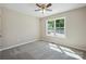 Carpeted bedroom with ceiling fan and bright natural light at 528 S Caldwell St, Salisbury, NC 28144