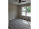 Cozy bedroom with plush carpet, a ceiling fan, and bright windows at 528 S Caldwell St, Salisbury, NC 28144