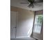 Bright bedroom featuring a ceiling fan, neutral paint, and a sunlit window at 528 S Caldwell St, Salisbury, NC 28144
